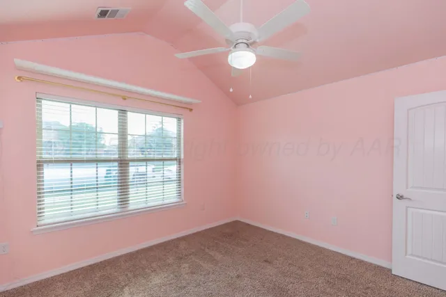 an empty room with closet area