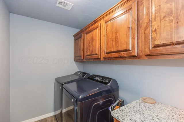 a view of storage and utility room with washer and dryer