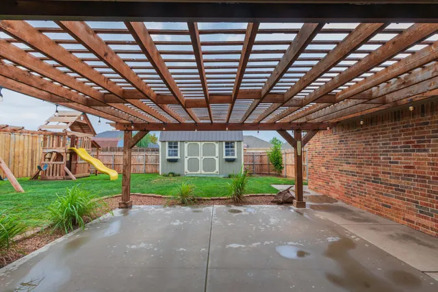 a view of a chairs and table in the patio