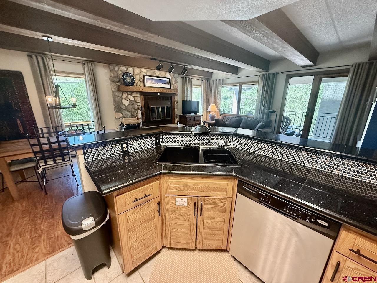 11 Snowmass Road, Unit 337 Crested Butte, CO 81225 - Photo 10 of 35 a kitchen with sink cabinets and appliances