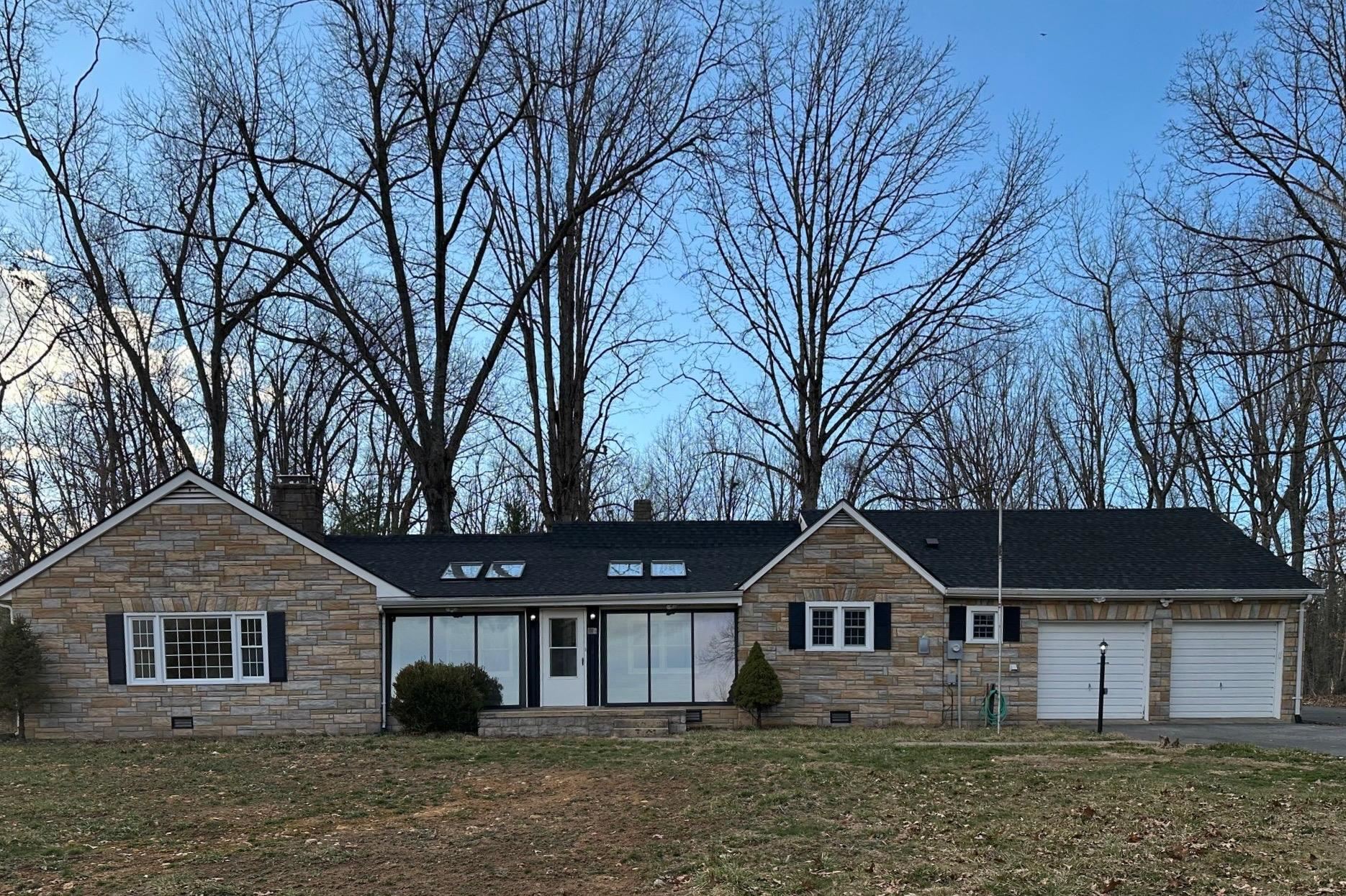 2205 Mt Torrey Road Lyndhurst, VA 22952 - Photo 1 of 43 a front view of a house with a garden