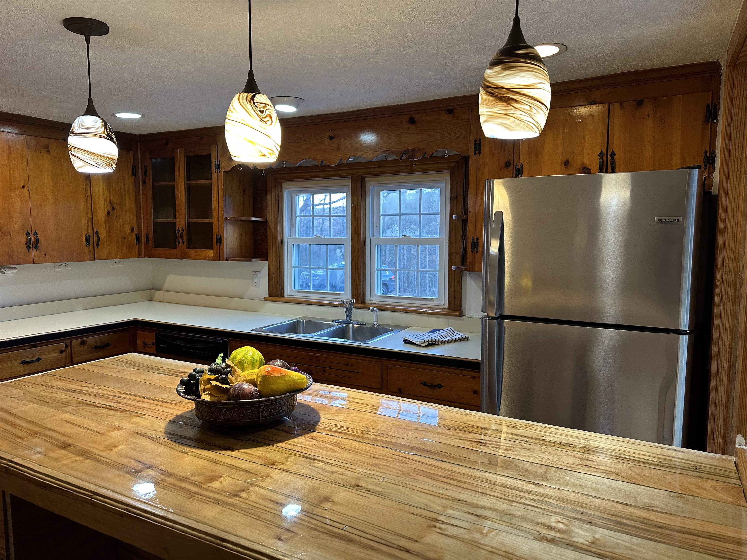 2205 Mt Torrey Road Lyndhurst, VA 22952 - Photo 25 of 43 a kitchen with a refrigerator and a chandelier