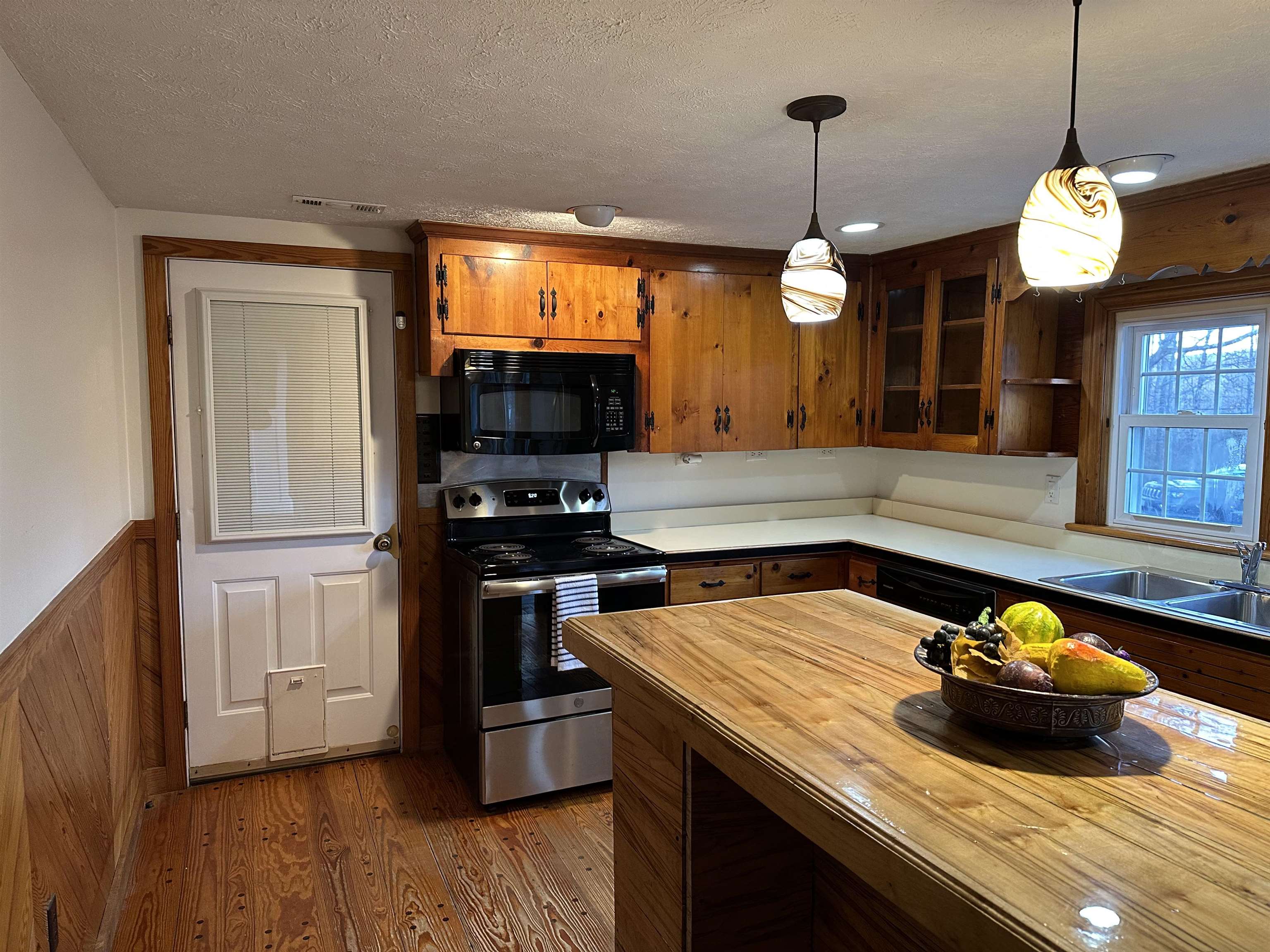 2205 Mt Torrey Road Lyndhurst, VA 22952 - Photo 26 of 43 a kitchen with a stove a sink and a wooden floor