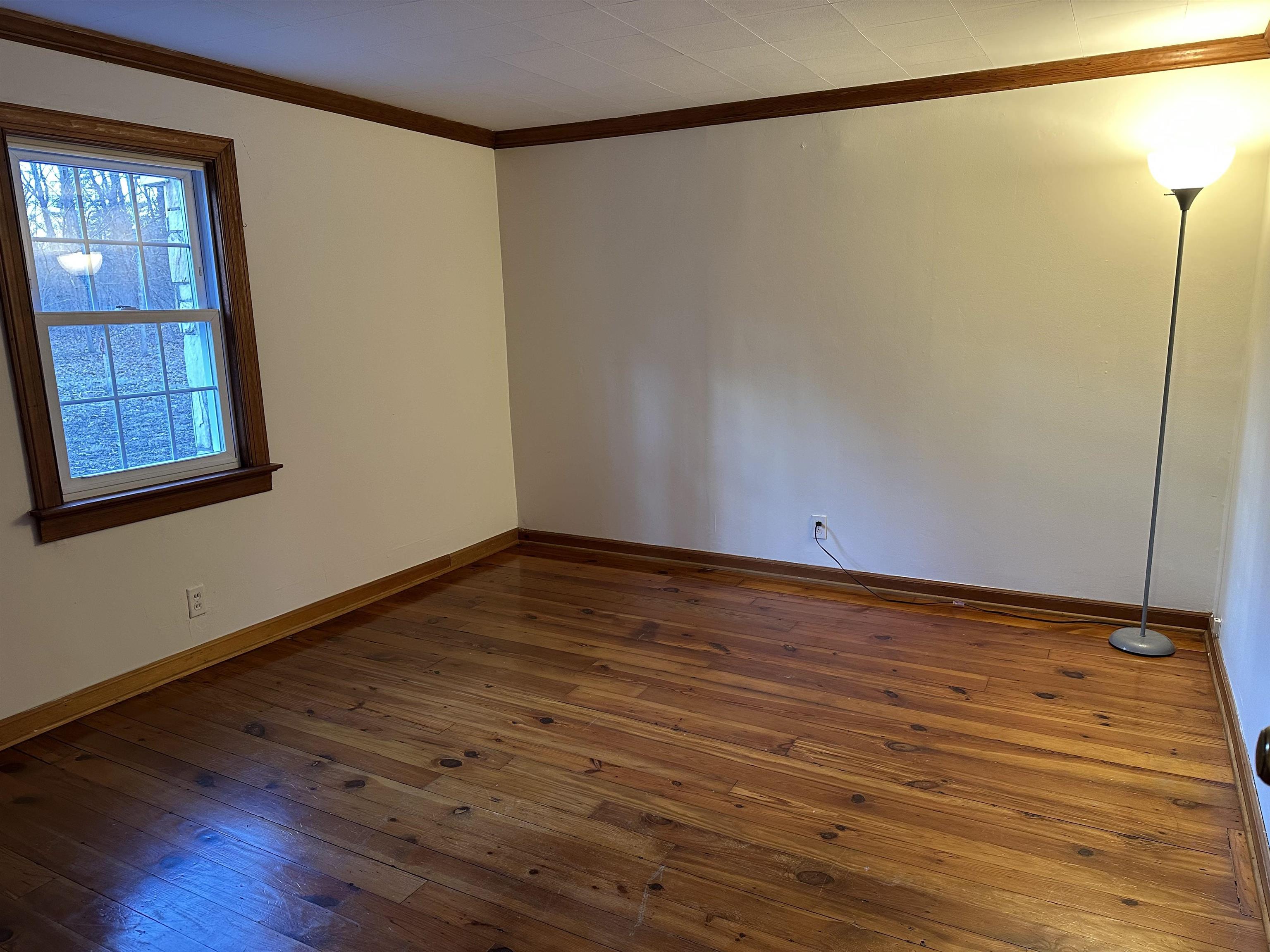 2205 Mt Torrey Road Lyndhurst, VA 22952 - Photo 30 of 43 a view of an empty room with wooden floor and a window