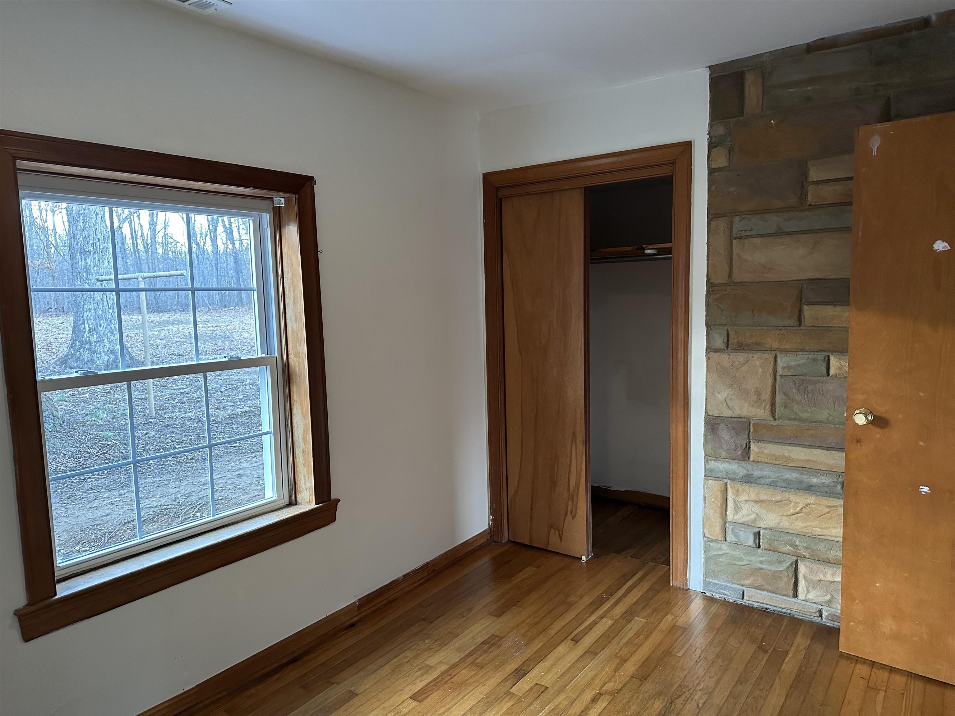 2205 Mt Torrey Road Lyndhurst, VA 22952 - Photo 32 of 43 an empty room with wooden floor and windows