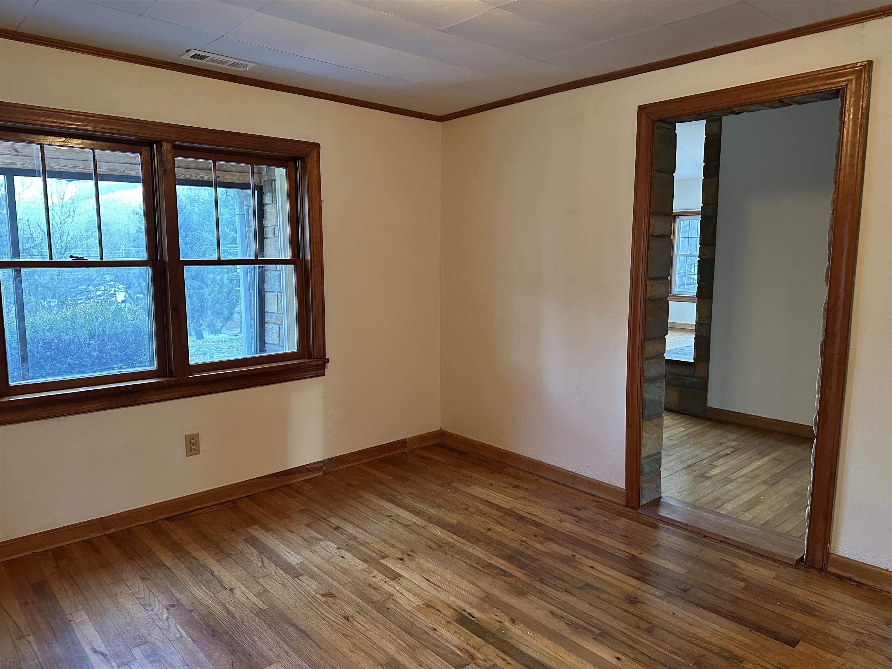 2205 Mt Torrey Road Lyndhurst, VA 22952 - Photo 36 of 43 a view of an empty room with wooden floor and a window