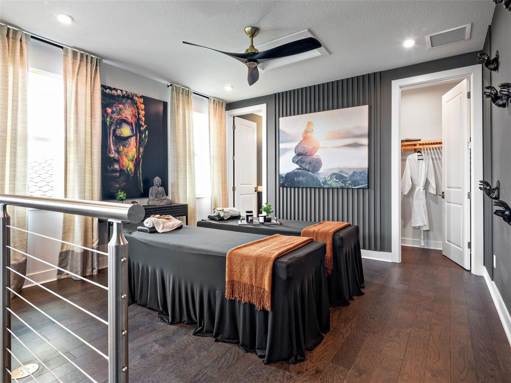 882 Liliana Drive Deland, FL 32724 - Photo 15 of 40 a bedroom with furniture a large window and a chandelier