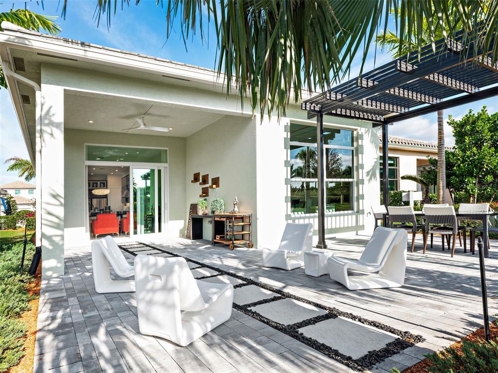 882 Liliana Drive Deland, FL 32724 - Photo 2 of 40 a view of a chairs and table in patio with a patio
