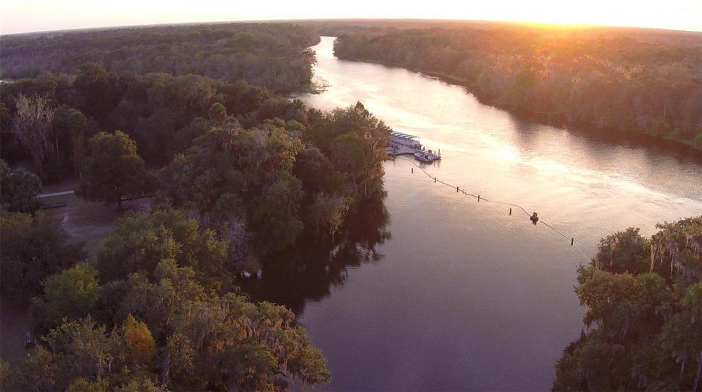 882 Liliana Drive Deland, FL 32724 - Photo 26 of 40 a view of a lake in middle of forest
