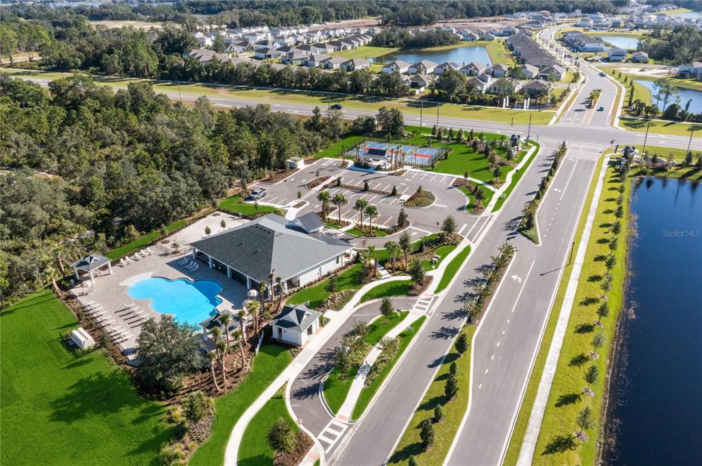 882 Liliana Drive Deland, FL 32724 - Photo 30 of 40 an aerial view of a house with a lake