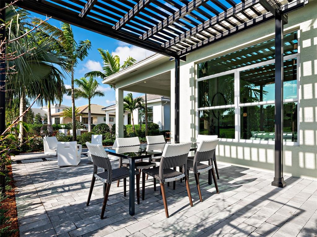882 Liliana Drive Deland, FL 32724 - Photo 3 of 40 a view of a dinning table and chairs in patio