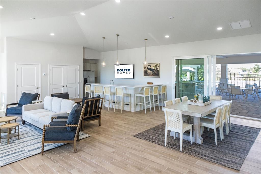 882 Liliana Drive Deland, FL 32724 - Photo 32 of 40 a view of a dining room with furniture window and wooden floor
