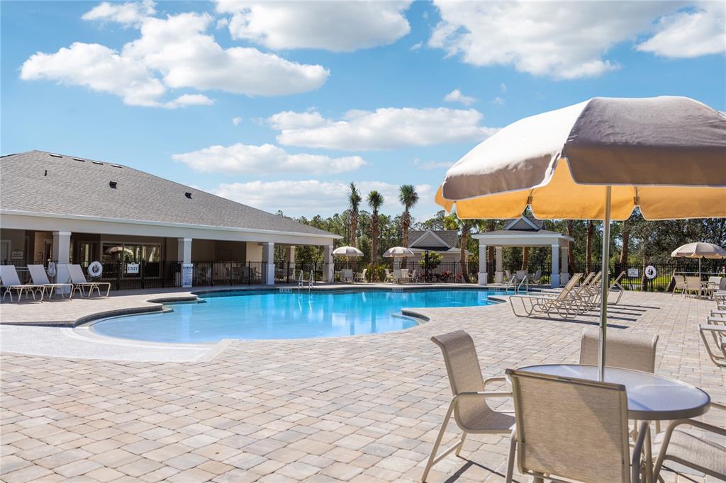 882 Liliana Drive Deland, FL 32724 - Photo 37 of 40 a view of a swimming pool with lounge chairs