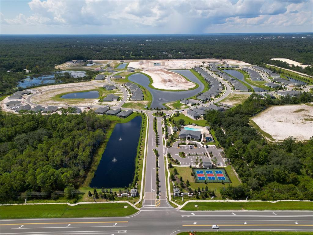 882 Liliana Drive Deland, FL 32724 - Photo 40 of 40 a view of swimming pool with a yard and large trees