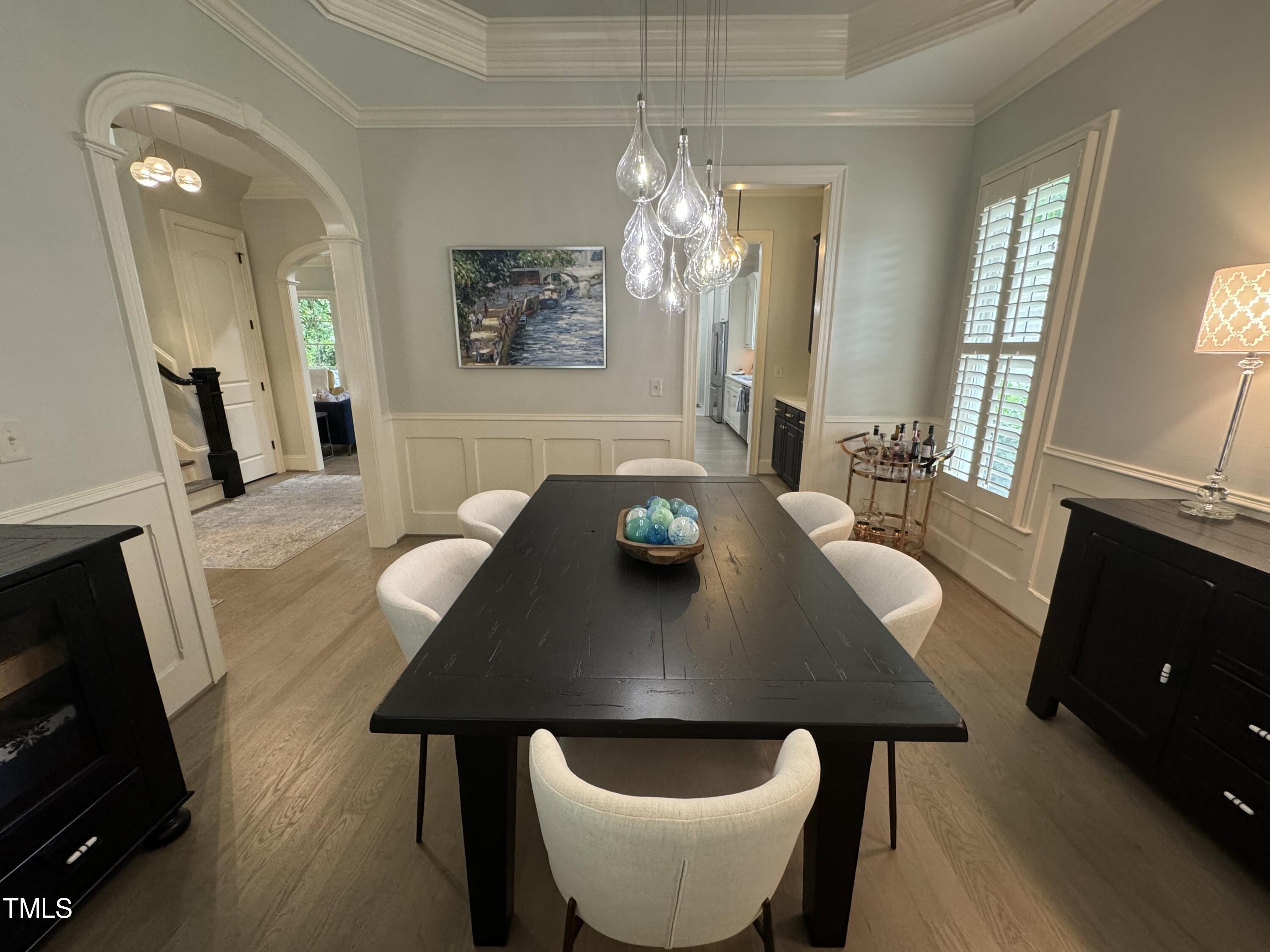 535 Guilford Circle Raleigh, NC 27608 - Photo 13 of 30 a view of a dining room with furniture and wooden floor