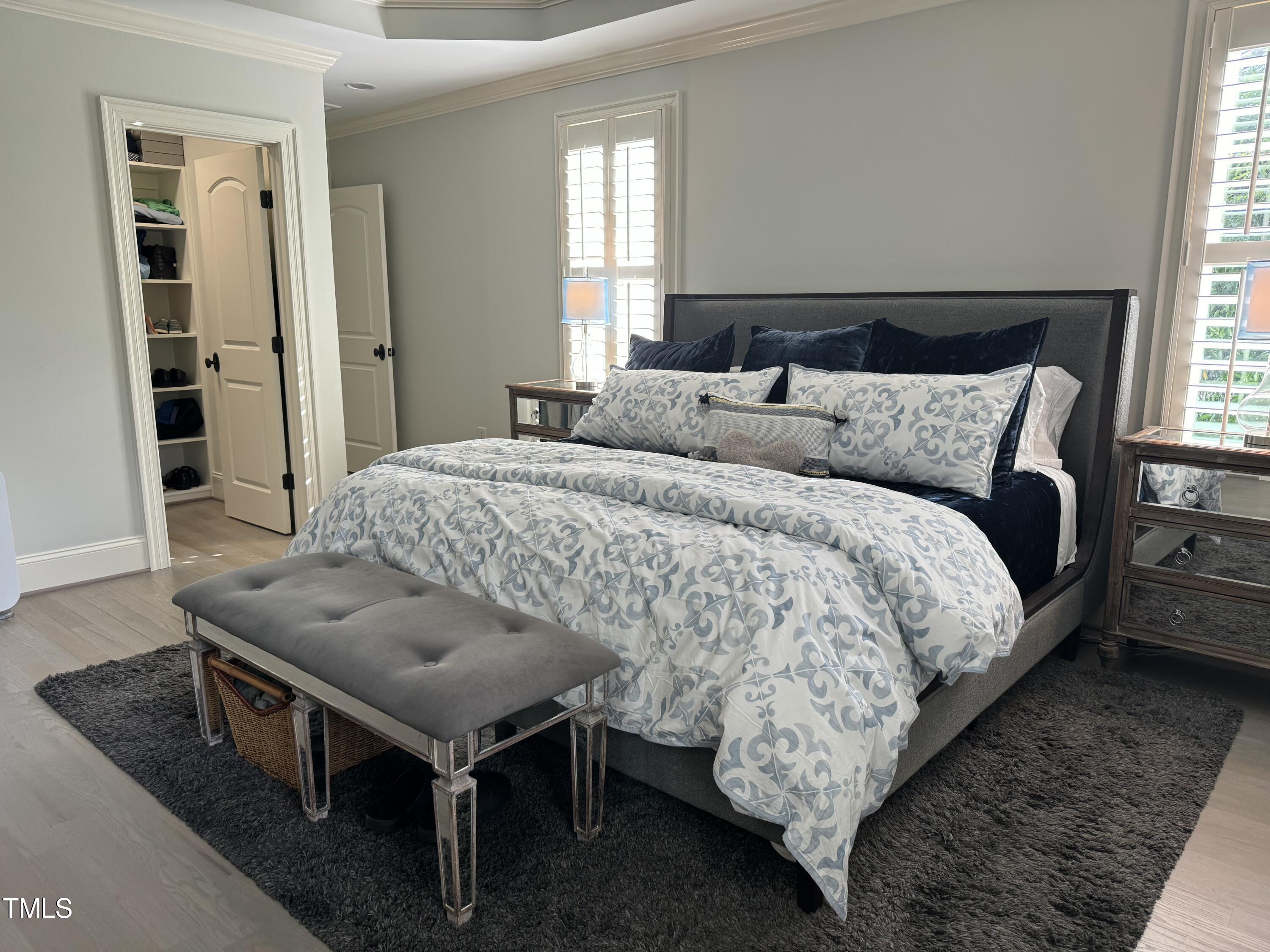 535 Guilford Circle Raleigh, NC 27608 - Photo 15 of 30 a bedroom with a bed and a night stand