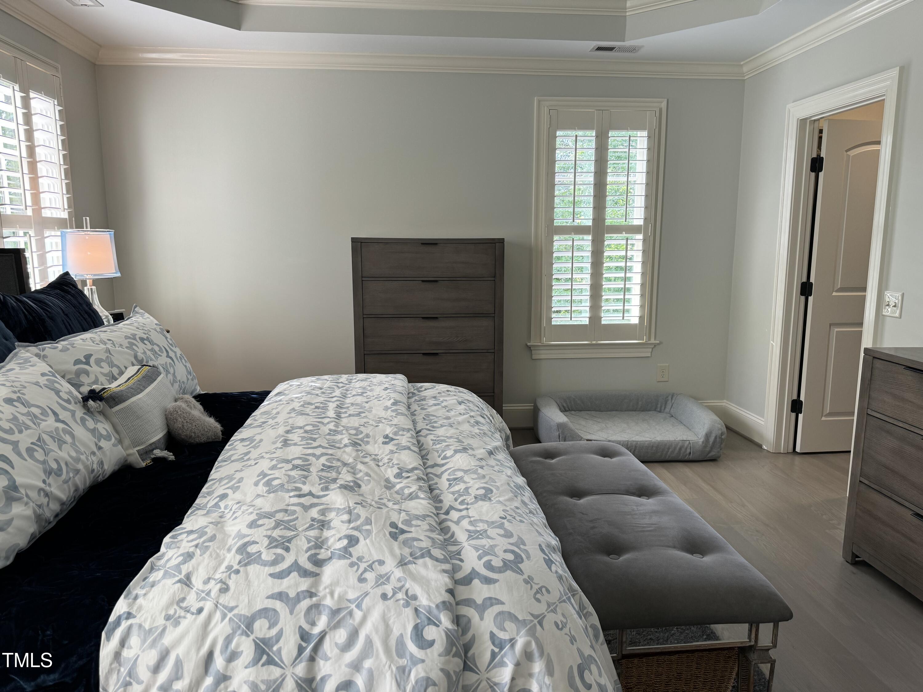 535 Guilford Circle Raleigh, NC 27608 - Photo 17 of 30 a bedroom with a bed and a couch