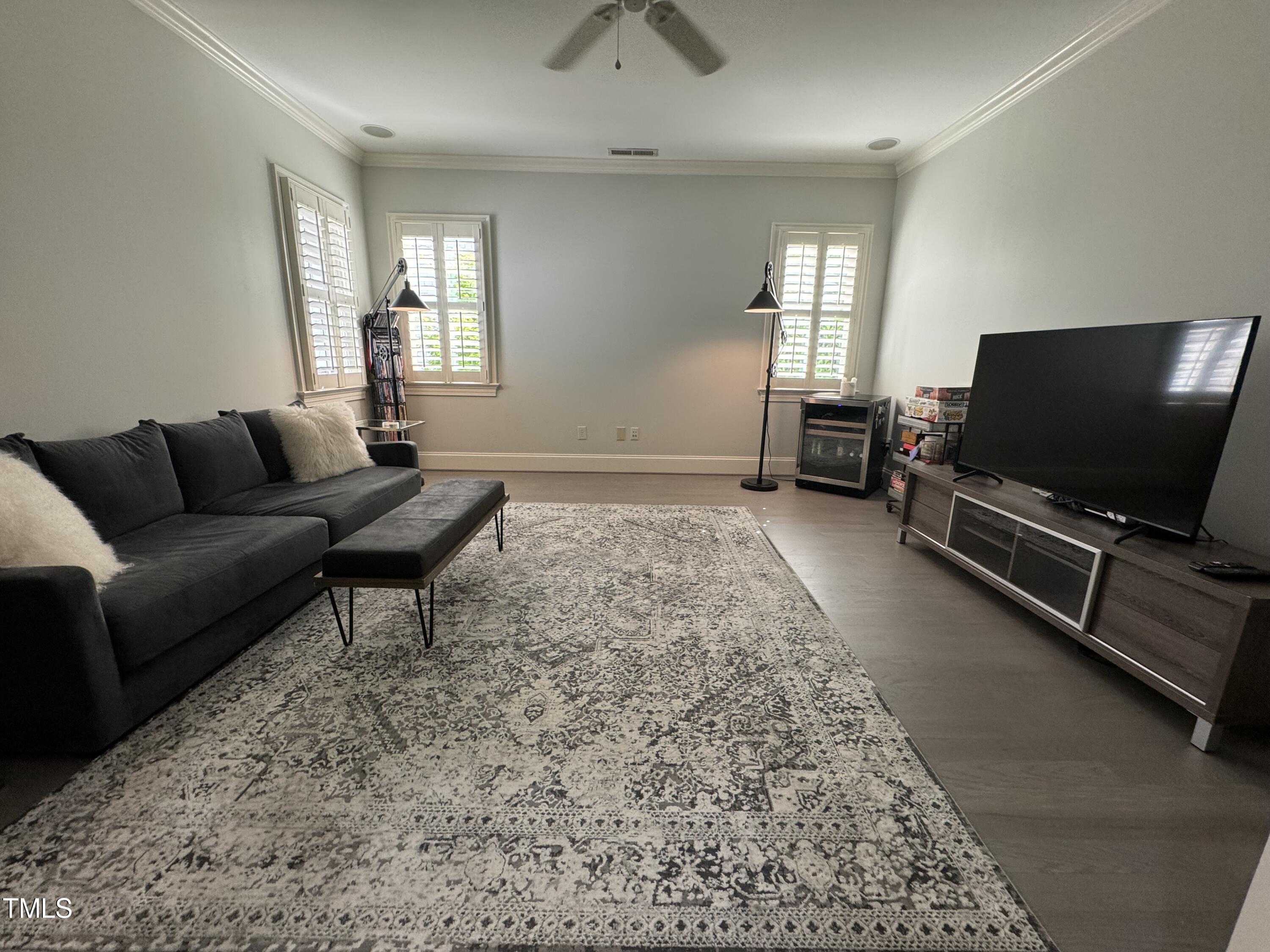 535 Guilford Circle Raleigh, NC 27608 - Photo 23 of 30 a living room with furniture and a flat screen tv