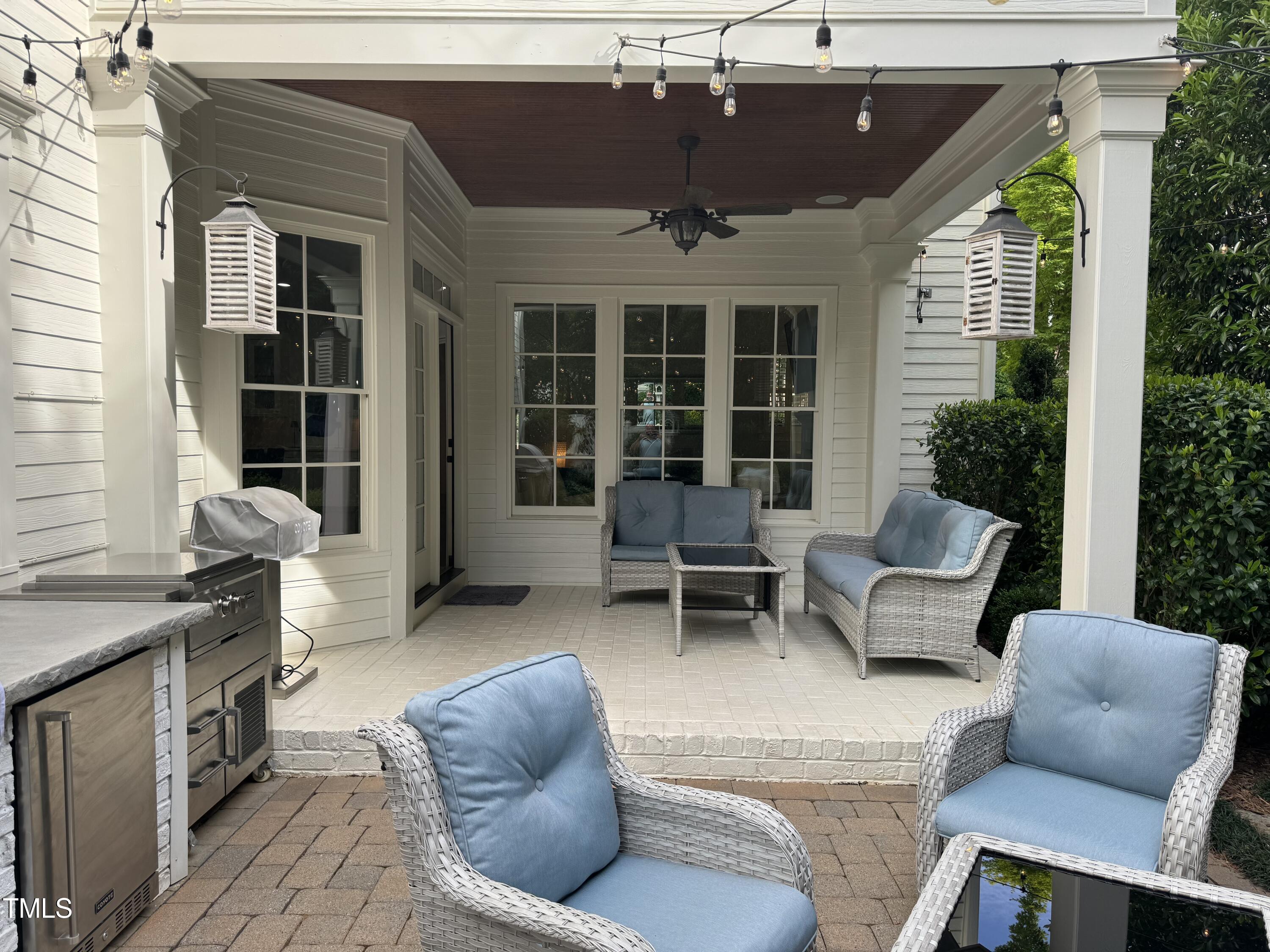 535 Guilford Circle Raleigh, NC 27608 - Photo 27 of 30 a balcony with furniture and a potted plant