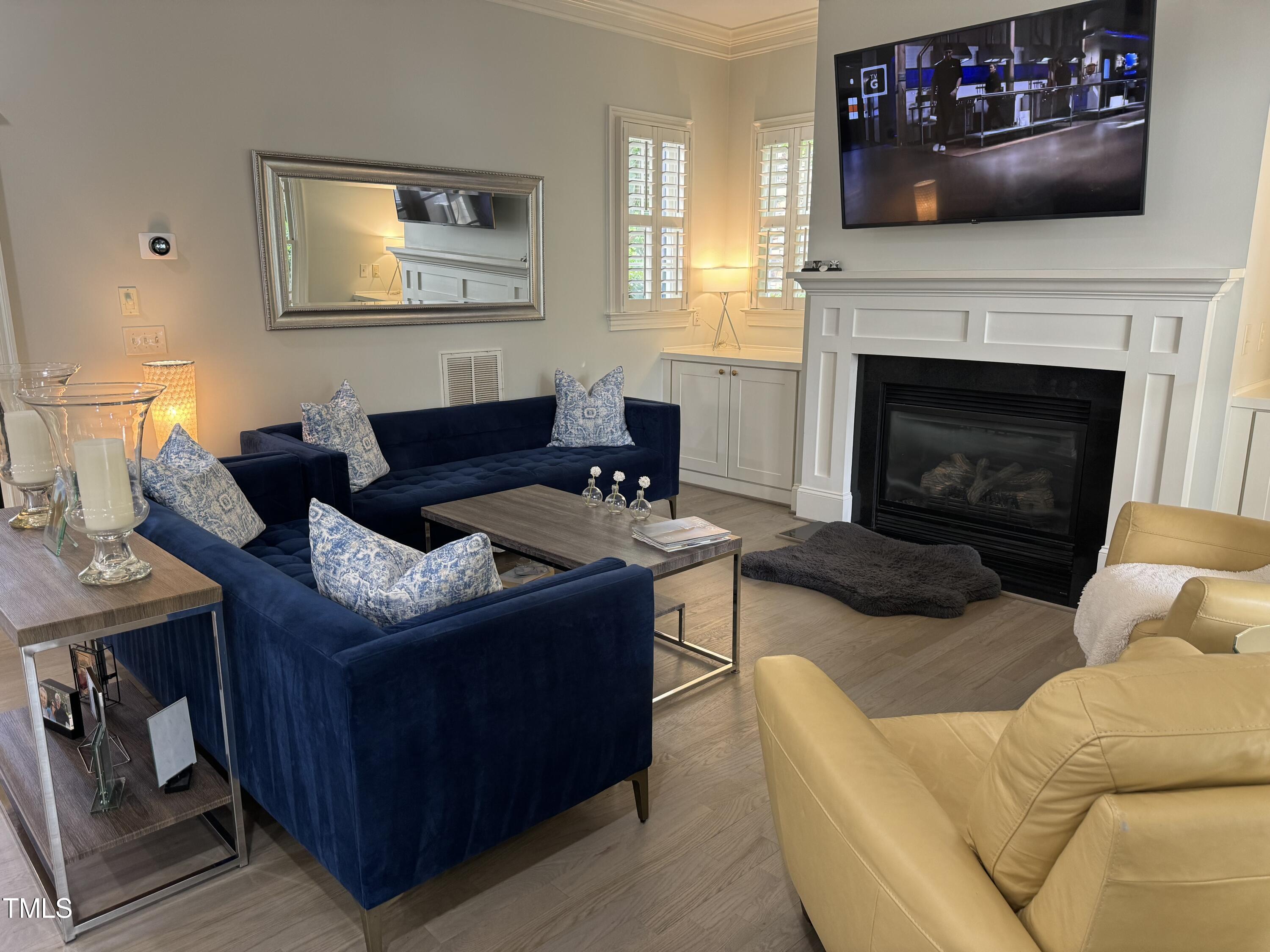 535 Guilford Circle Raleigh, NC 27608 - Photo 5 of 30 a living room with furniture and a fireplace