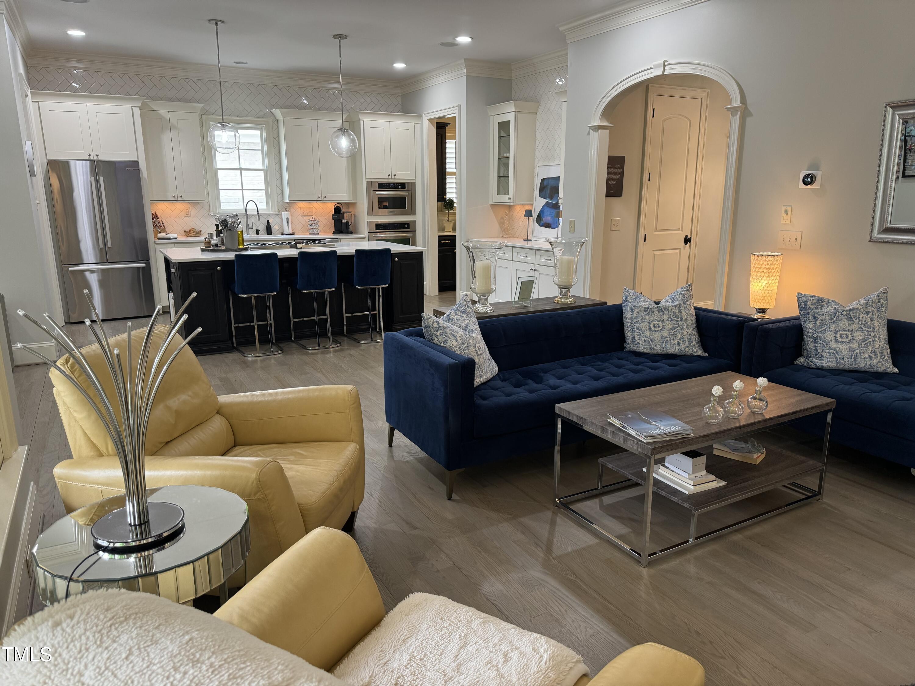 535 Guilford Circle Raleigh, NC 27608 - Photo 6 of 30 a living room with furniture kitchen view and a large window