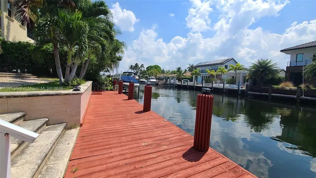 a view of a lake with a house in the background