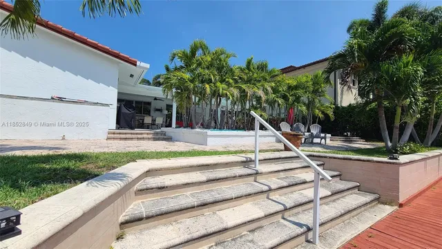 a view of a swimming pool with a patio