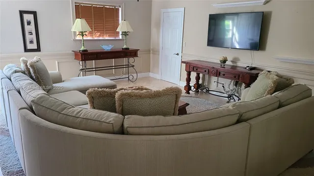 a living room with furniture and a couch