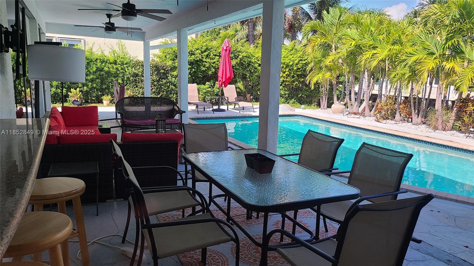 4211 Northeast 25th Avenue Lighthouse Point, FL 33064 - Photo 29 of 29 a view of a dining room with furniture window and outside view