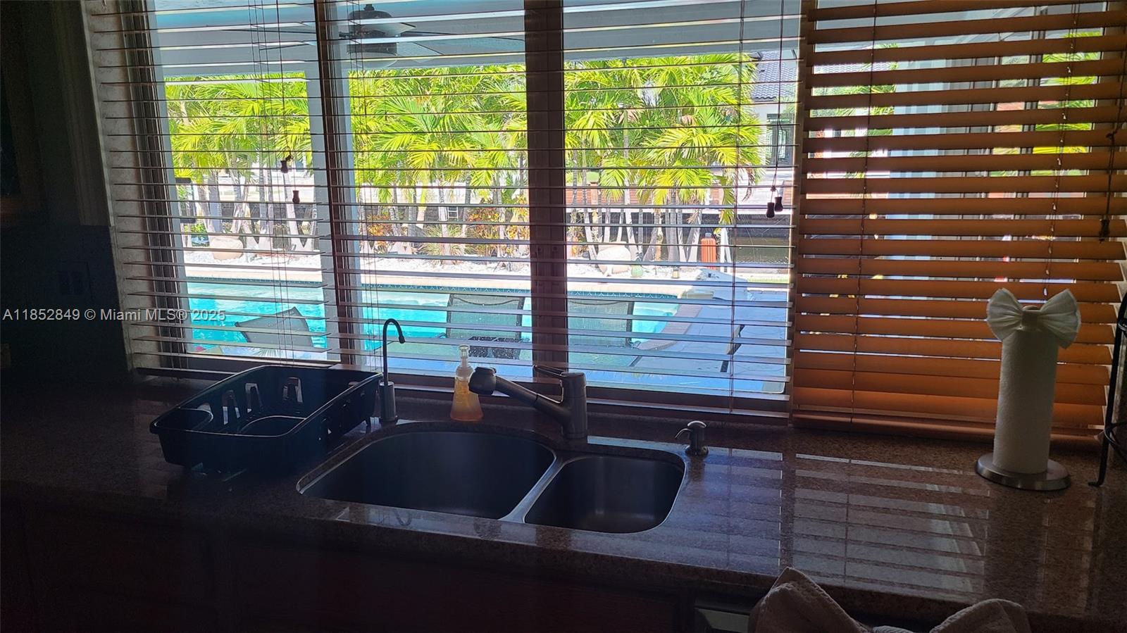 4211 Northeast 25th Avenue Lighthouse Point, FL 33064 - Photo 8 of 29 a bathroom with a sink a mirror and next to a window