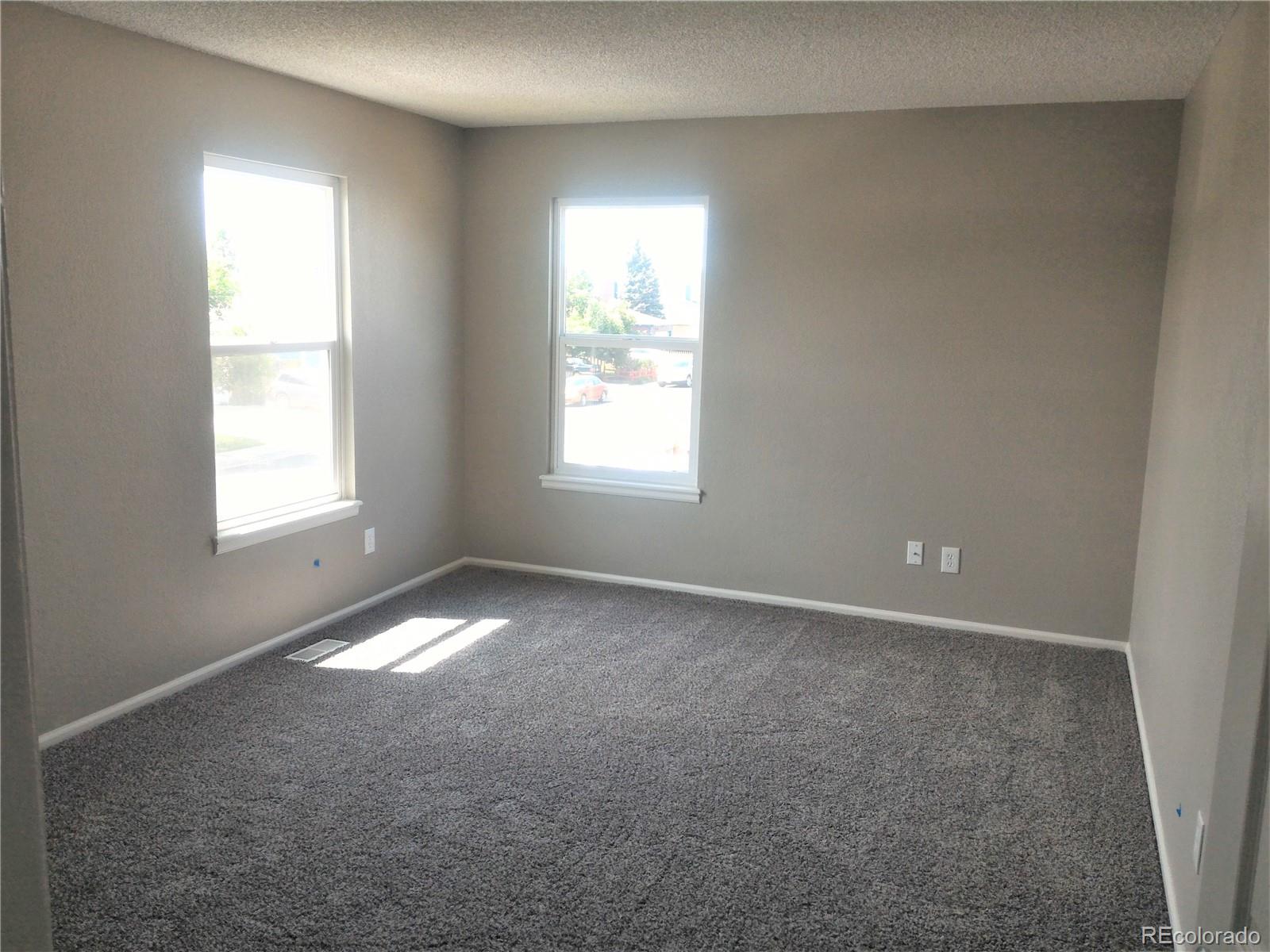 1689 Ensenada Way Aurora, CO 80011 - Photo 5 of 15 an empty room that has a window