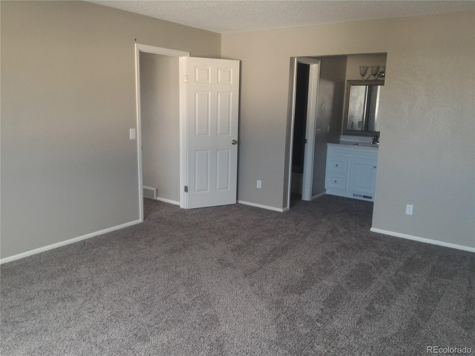 1689 Ensenada Way Aurora, CO 80011 - Photo 6 of 15 an empty room with windows and closet