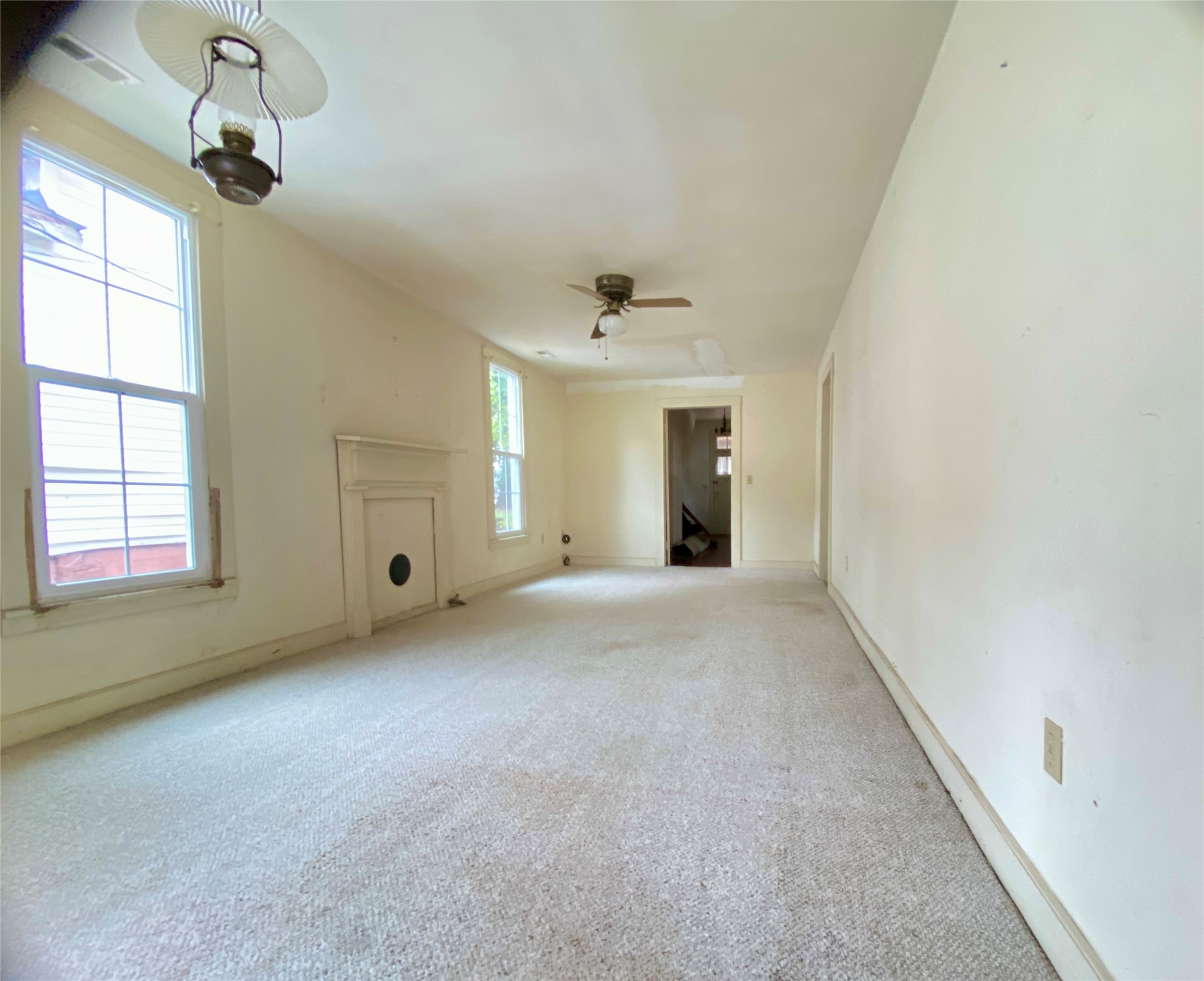 108 West Liberty Street Washington, GA 30673 - Photo 15 of 24 a view of an empty room with a window