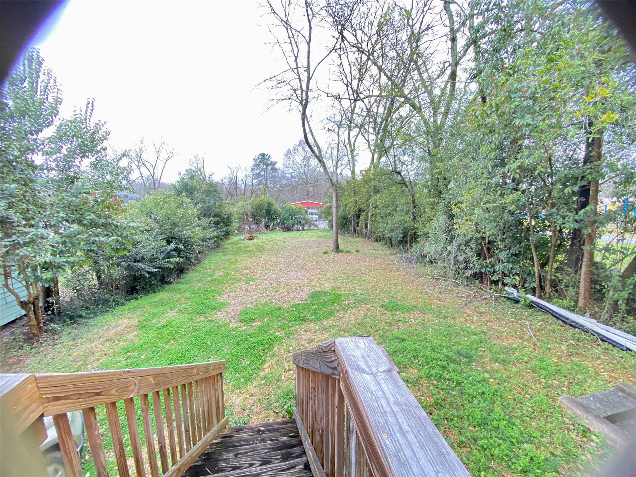108 West Liberty Street Washington, GA 30673 - Photo 23 of 24 a view of a backyard with wooden fence