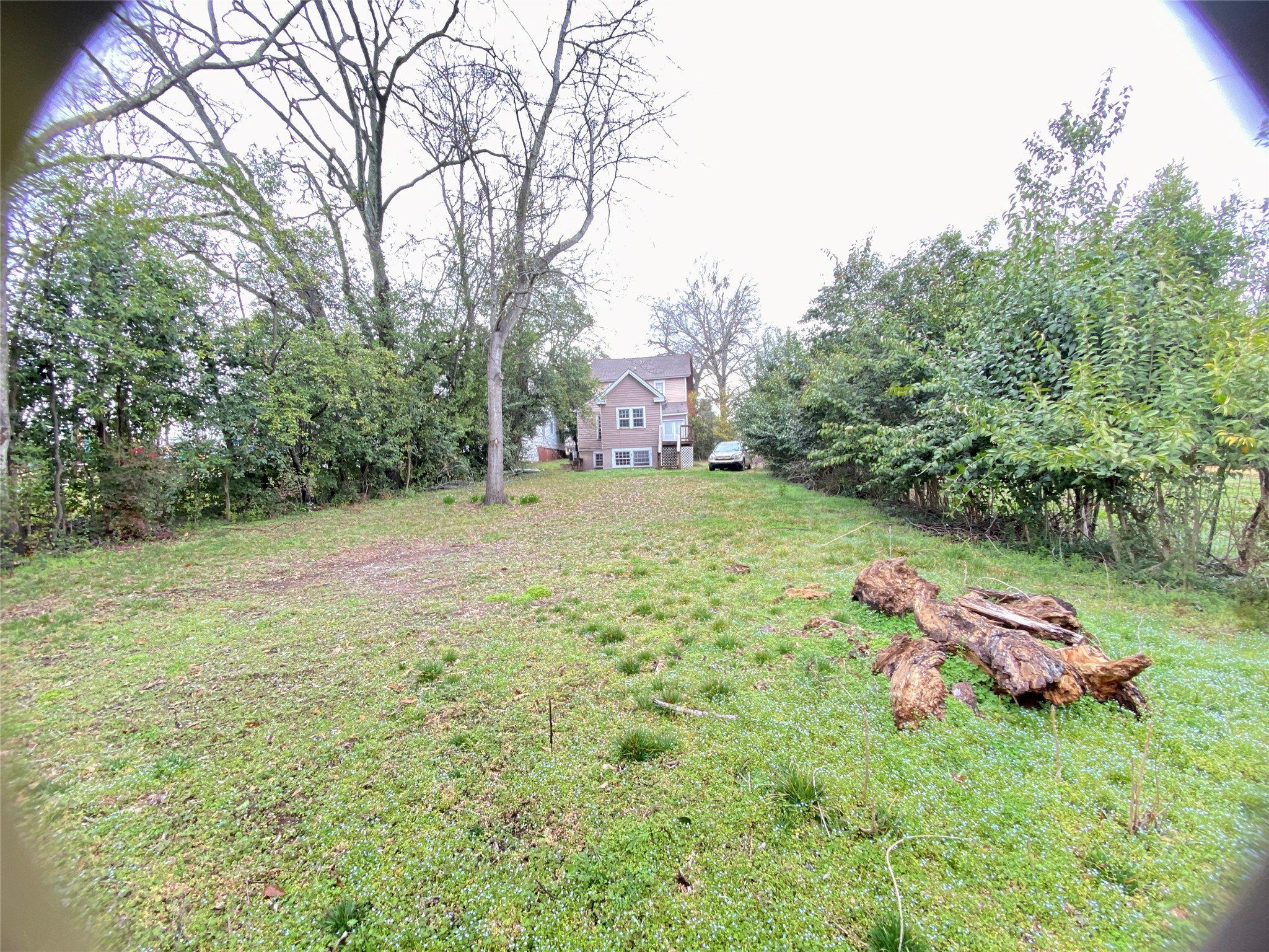 108 West Liberty Street Washington, GA 30673 - Photo 24 of 24 a backyard of a house with table and chairs