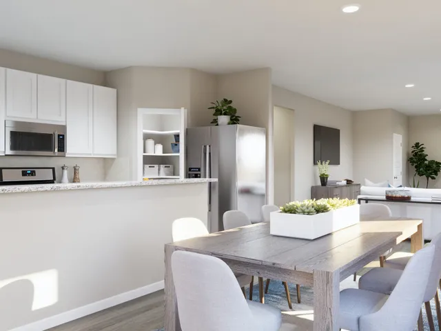 a bedroom with a flat screen tv on the dresser and a window