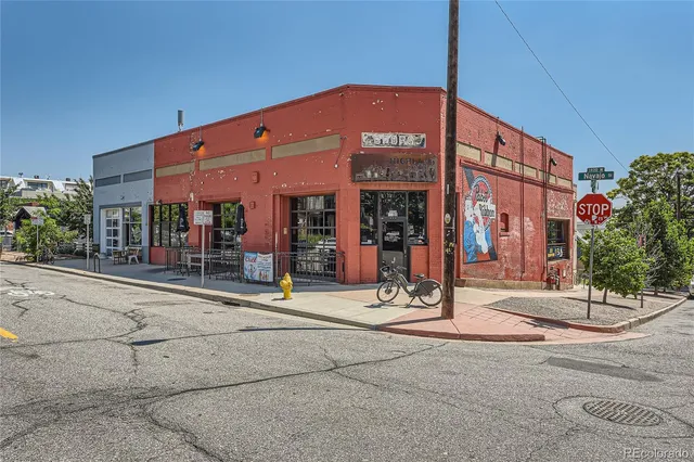 a view of a building with sitting area