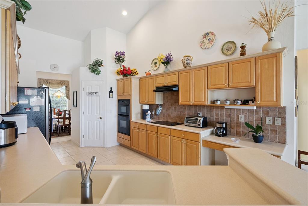1584 Cherry Ridge Drive Lake Mary, FL 32746 - Photo 11 of 62 a kitchen with stainless steel appliances granite countertop a sink a stove and a refrigerator