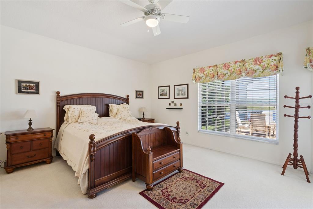 1584 Cherry Ridge Drive Lake Mary, FL 32746 - Photo 28 of 62 a bedroom with a bed a dresser and a window