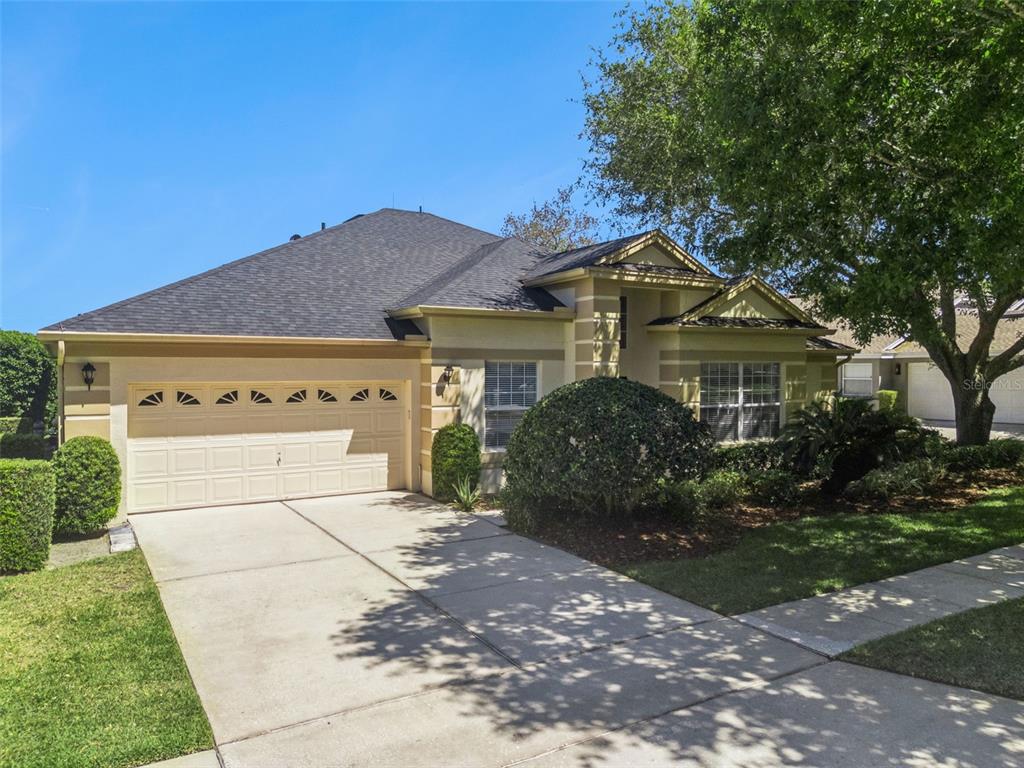 1584 Cherry Ridge Drive Lake Mary, FL 32746 - Photo 3 of 62 a front view of a house with a yard and garage