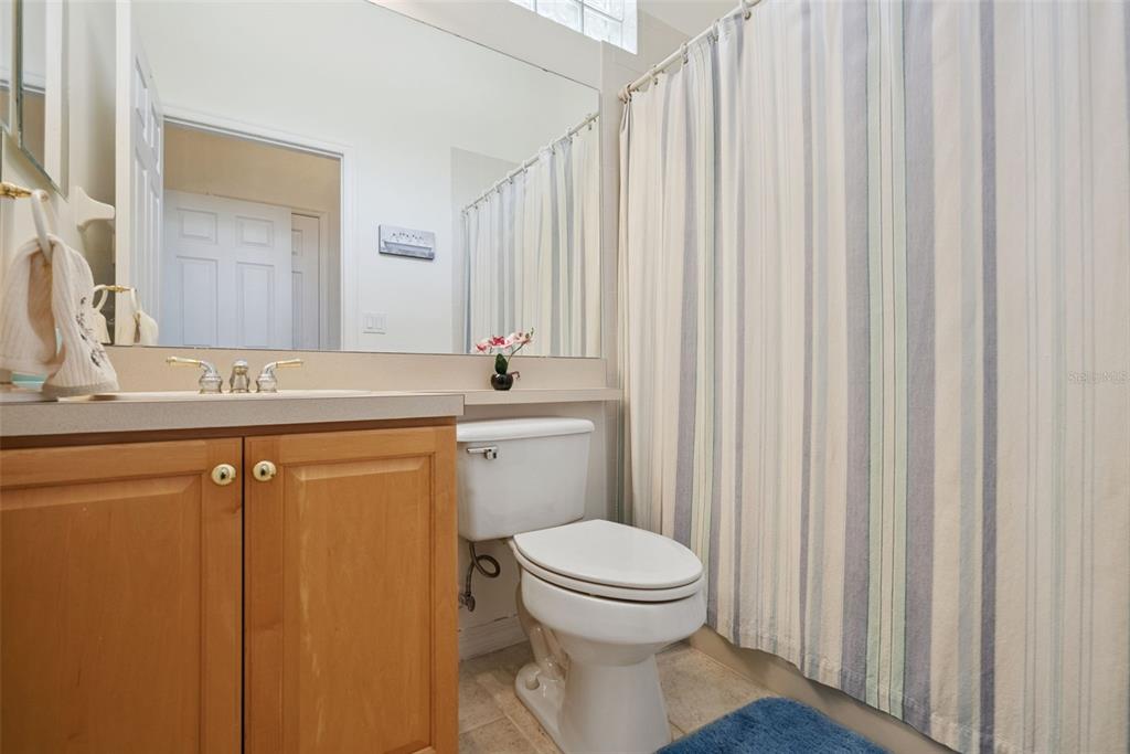 1584 Cherry Ridge Drive Lake Mary, FL 32746 - Photo 33 of 62 a bathroom with a sink a toilet and a mirror