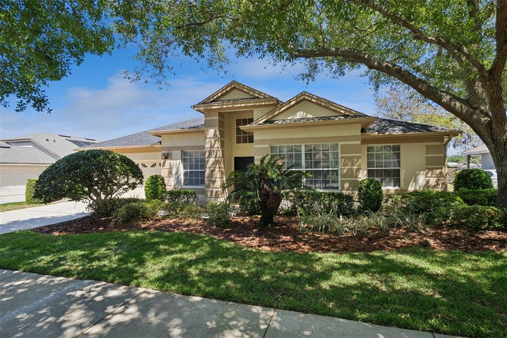 1584 Cherry Ridge Drive Lake Mary, FL 32746 - Photo 4 of 62 a front view of a house with a yard
