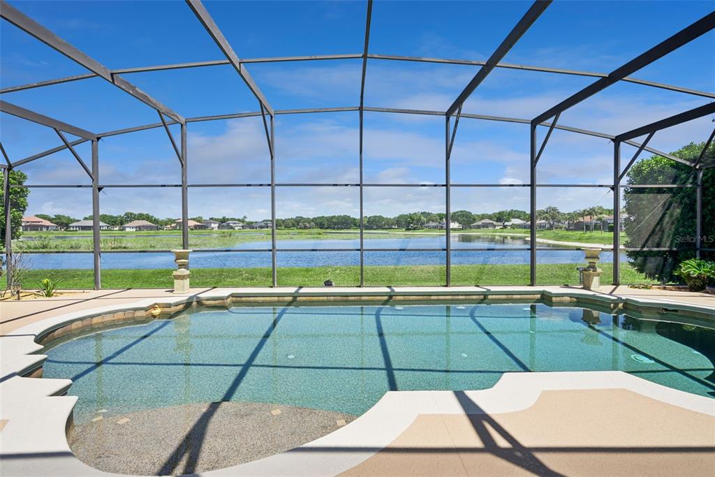 1584 Cherry Ridge Drive Lake Mary, FL 32746 - Photo 42 of 62 a view of a swimming pool with a lounge chairs