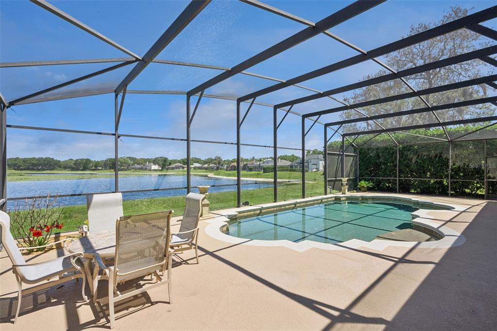 1584 Cherry Ridge Drive Lake Mary, FL 32746 - Photo 43 of 62 a view of a patio with a table and chairs under an umbrella