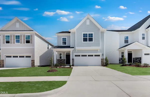 a view of house with yard and entertaining space