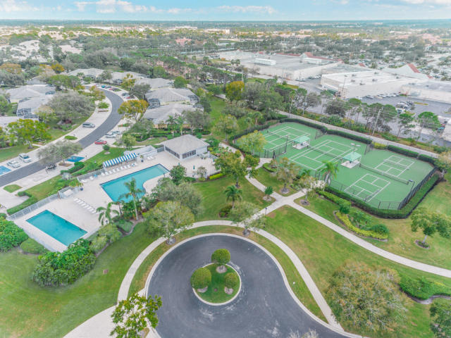 1201 Northwest Sun Terrace Circle, Unit D Port St. Lucie, FL 34986 - Photo 16 of 18 aerial pool and tennis sun ter