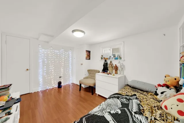 a bathroom with a granite countertop sink mirror and a shower