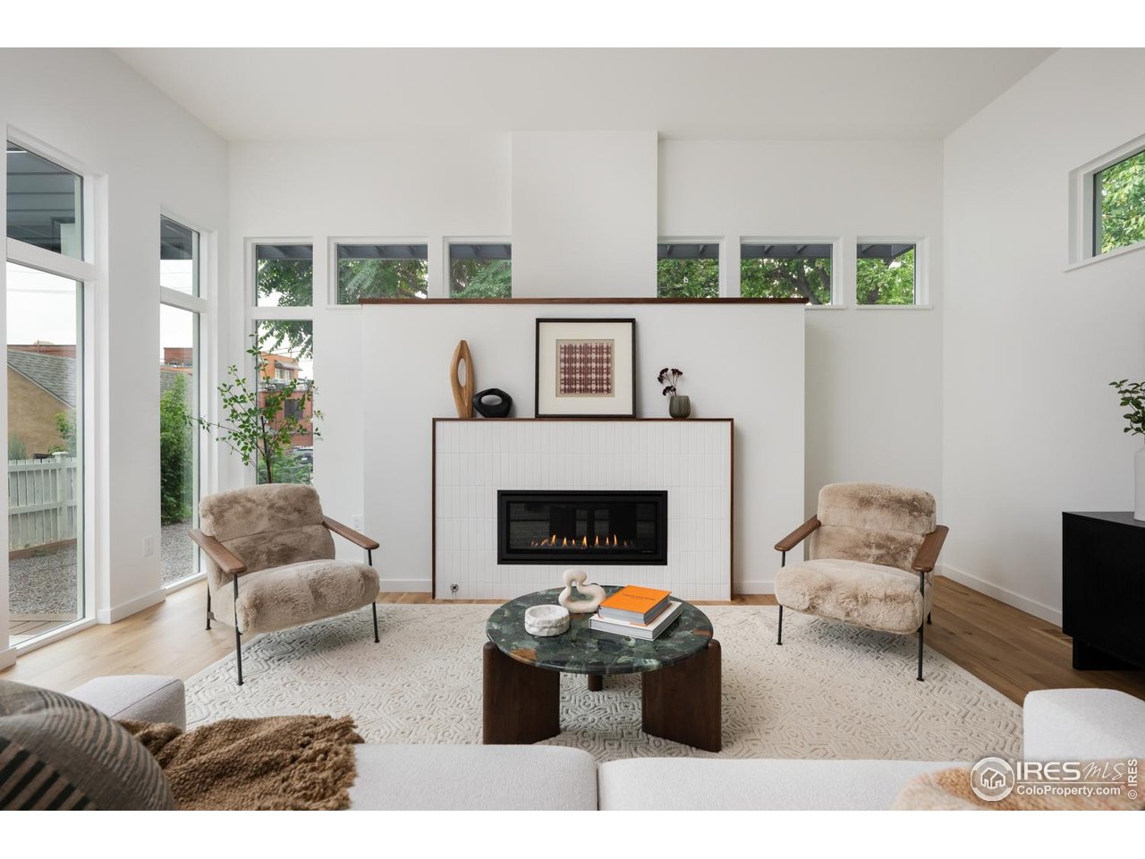 934 Spruce Street Boulder, CO 80302 - Photo 12 of 49 Cozy gas fire place with floor to ceiling windows.