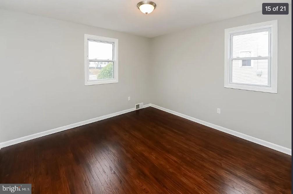 112 Upland Road Brookhaven, PA 19015 - Photo 15 of 21 a view of a room that has wooden floor and window