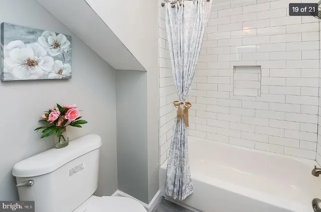 an empty room with an entrance to other room